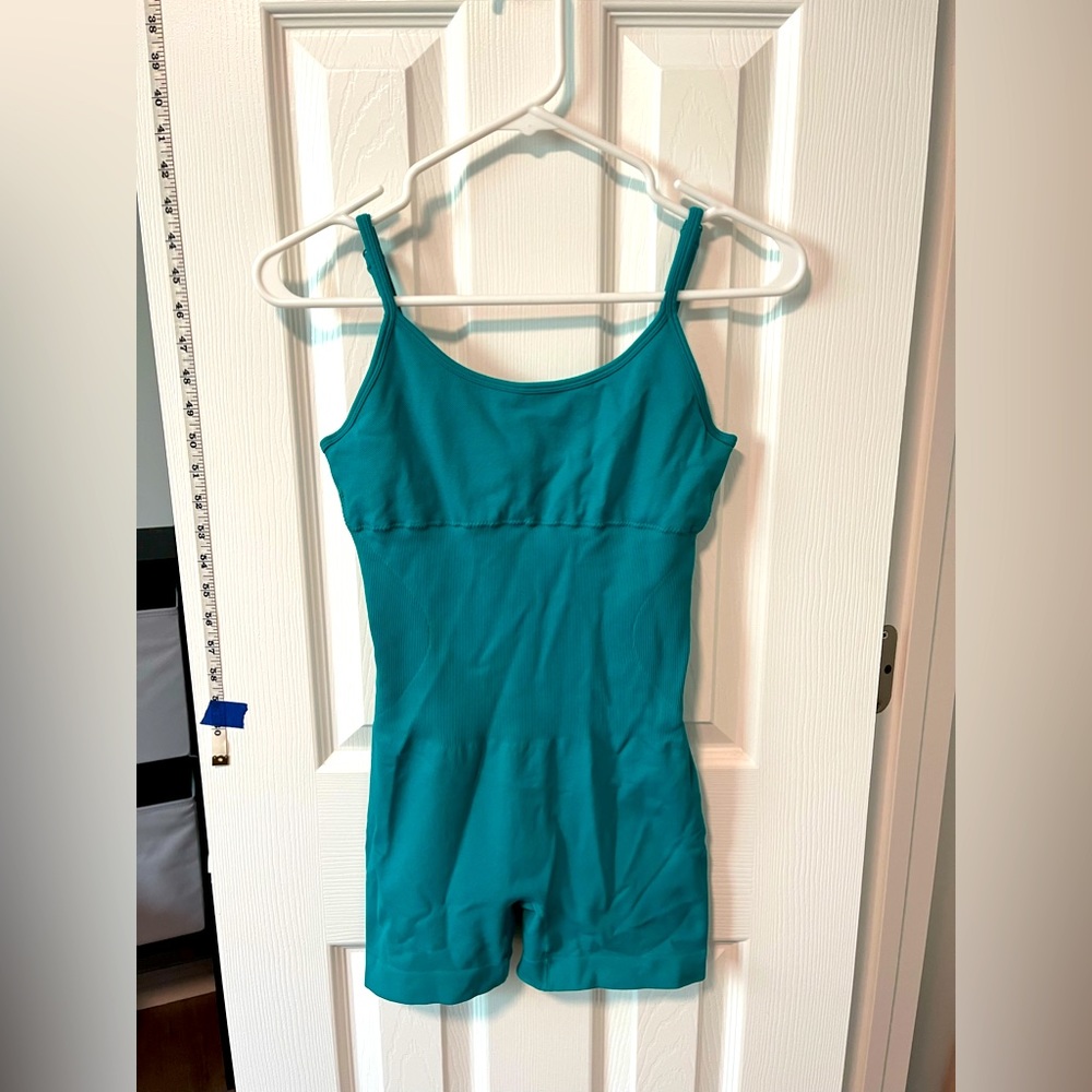 Aqua colored jumper, workout material.